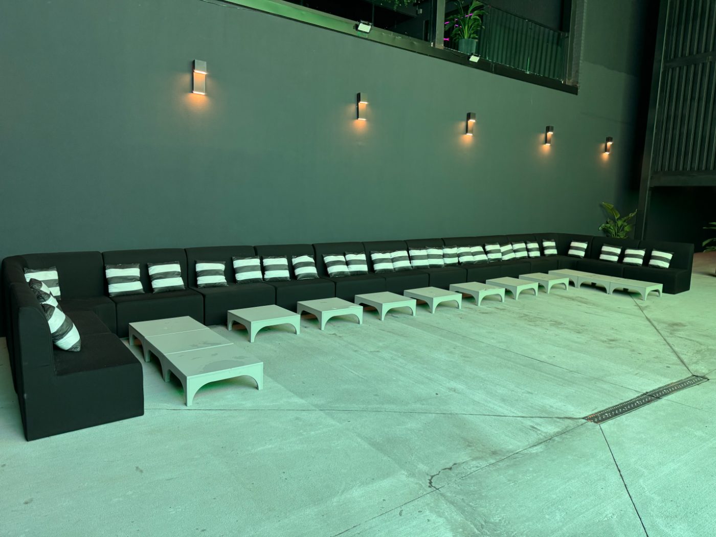 Seating under the giant LED screen in the Arena at Partake NYC